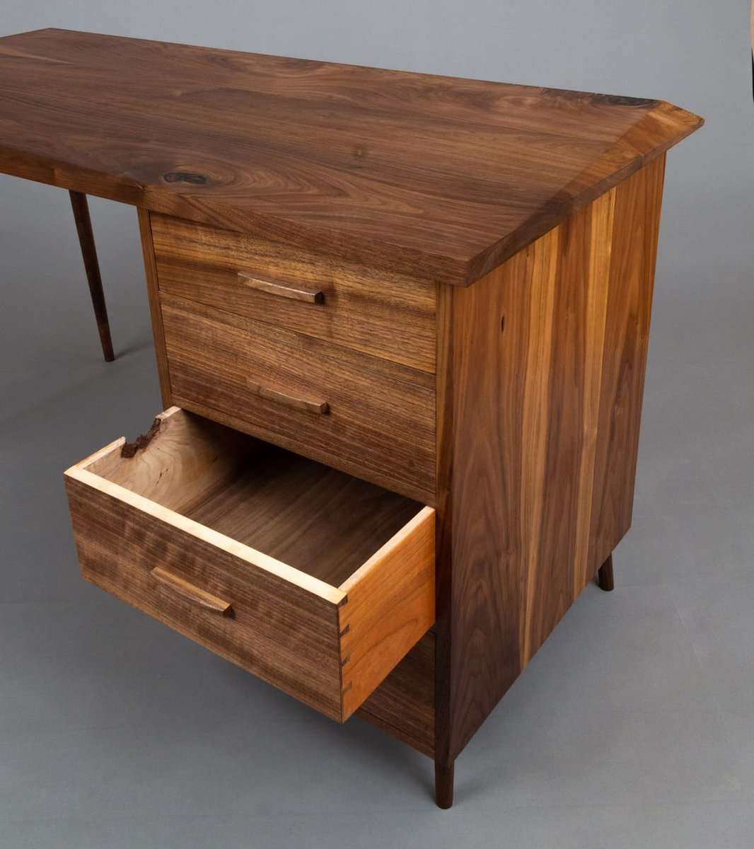 Custom walnut desk with open drawer and live edge detail in Central Connecticut by Riverbend Renovations